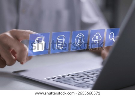 Document management concept. cloud storage, audit trails, security and search. Businessman using laptop document management system on virtual screen.