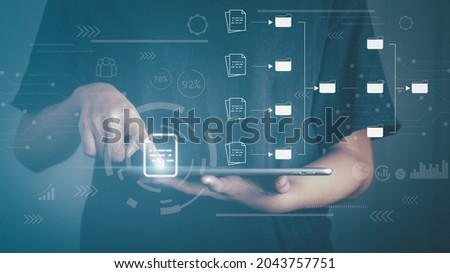 Document management concept. Hand touch on table document virtual icon and connecting line database and process automation to efficiently manage files.