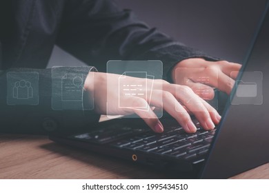 Document management concept. User working on laptop computer in office and online documentation database icon on screen corporate files and information. Business processes.