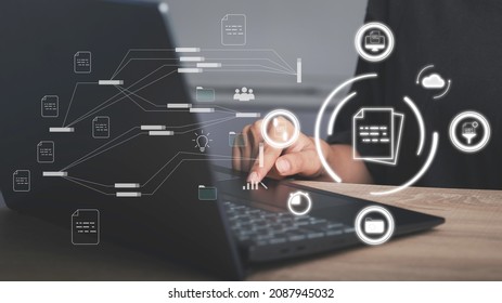 Document management, Database directory, E-document, Paperless office concept. Hand used laptop show document virtual icon and connecting line database process automation to efficiently manage file. - Shutterstock ID 2087945032