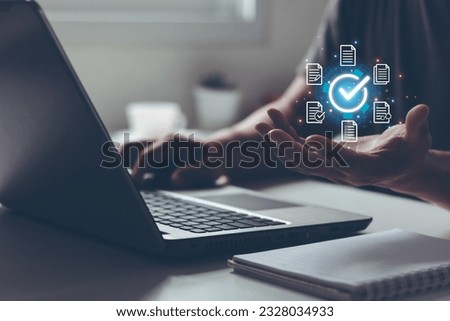 Document management DMS System Digital rights management. Businessmen hand show virtual glowing correct sign mark and document for online approve paperless and quality assurance concept.
