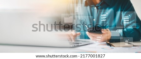 Document management system concept, business man holding folder and document icon software, searching and managing files online document database, for efficient archiving and company data.