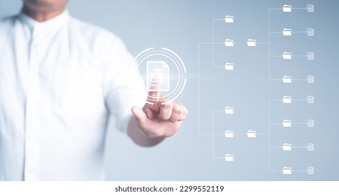Document management system concept, DMS. Online documentation database software for efficient management company data files. Businessman standing and arranging folder and files icon on virtual screen.