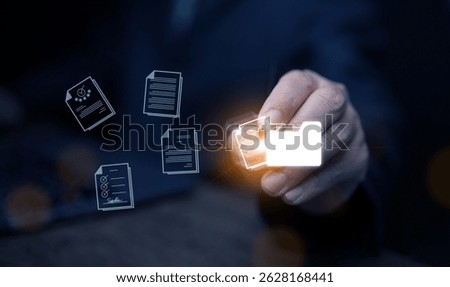 Document Management System concept. A man drags and drops files into DMS software to store, share, track and manage files or documents.