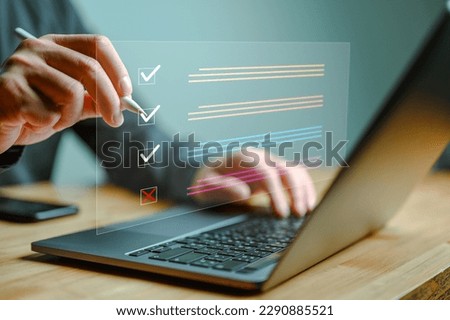 Document management system DMS. Assessment form, questionnaire, checklist and clipboard task management. Businessman working on laptop computer productivity checklist and filling survey form online.