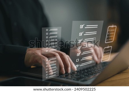 Document management system DMS. Assessment form, questionnaire, checklist and clipboard task management. Businessman working on laptop computer productivity checklist and filling survey form online.