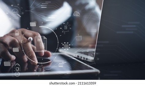 Document Management System (DMS) being setup by IT consultant working on laptop computer in office. Software for archiving, searching and managing corporate files and information - Shutterstock ID 2111613359