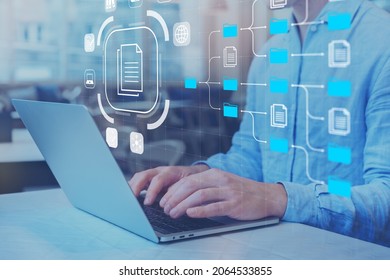 Document Management System (DMS) and business processes with IT expert working on laptop computer. Solution for archiving, searching and managing corporate files and data. Digital transformation. - Shutterstock ID 2064533855