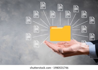 Document Management System DMS .Businessman hold folder and document icon.Software for archiving, searching and managing corporate files and information.Internet Technology Concept.Digital security