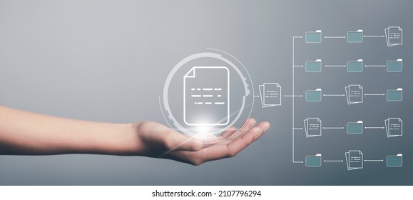 Document Management System (DMS) concept. Hand hold file icon Virtual screen automation software to archiving and efficiently manage and information with ERP. Corporate business technology. - Shutterstock ID 2107796294