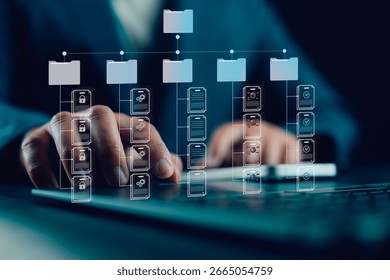 Document management system, DMS. Folder structure and classification system. File and folder icons. Businessman using laptop for controlling document versions.