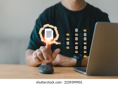 Document Management System (DMS). Setup by IT consultant working on a laptop computer in office. software for archiving, searching, and managing corporate files and information. Digital transformation