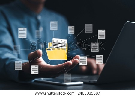 Document management system (DMS) technology, Businessman using laptop with database folder online to store files document data digital. file storage process with security. 
