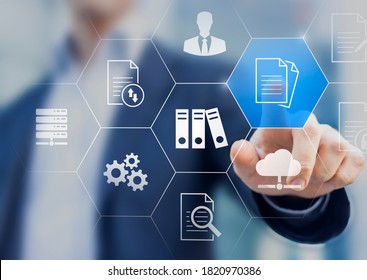 Document Management System (DMS) Used To Store, Search And Manage Review Process And Users For Corporate Files And Information In Enterprise. Concept With Business Manager Pointing To Icons.