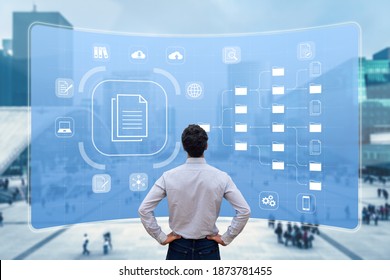 Document Management System (DMS) used to archive, search and manage corporate files and information in enterprise along business processes. Concept with manager looking at screen - Shutterstock ID 1873781455