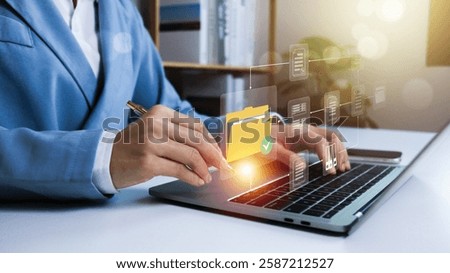 Document Management System (DMS),Businessman using a laptop searching folder and managing files paperwork.Software for archiving,share online database server, administration employee in enterprise.