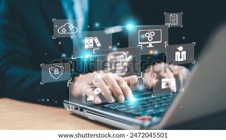 Document management system services concept. Business database electronic document, online data storage network. Businessman working on a laptop with document management icon, Online file technology