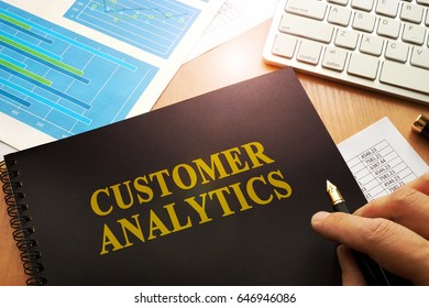 Document With Name Customer Analytics In An Office.