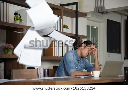 Document paper floating in the air in front of  disheartened man