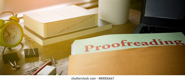 Document For Proof Reading With Stationery And Computer On Table