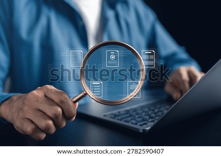 Document quality inspecting and compliance verification process with magnifying glass. close up of a man checking a paper document for accuracy and standards.