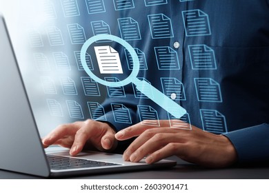Document retrieval and text search engine. Document management system DMS. Magnifying glass and file icons. Businessman using laptop computer to search by keyword.