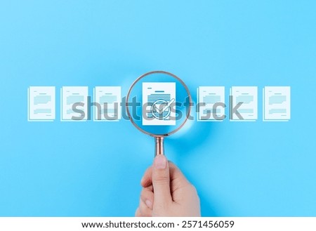 Document Review and Quality Control Process Concept. A hand holding a magnifying glass focuses on a document with a checkmark, document review, and approval processes. Certificate management, Audit,