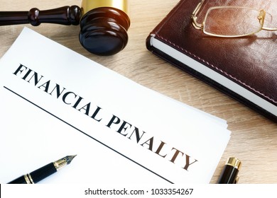 Document With Title Financial Penalty On A Desk.