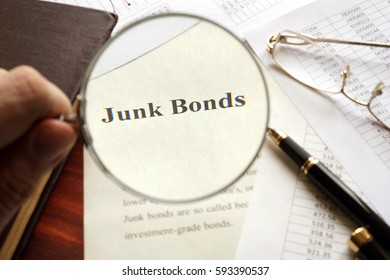 Document With Title Junk Bond On A Table. Selective Focus.