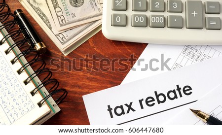 Document with title tax rebate on a table.