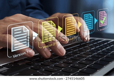Document version control. Revision history and change tracking. Businessperson using laptop computer to edit documents.