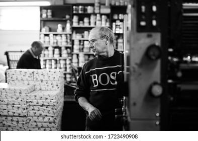 Documentary Photography Of A Commercial Printer: A Heidelberg Printer With Male Employees And The Interior Of A Print Workshop