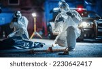 Documentary Shot: Forensics Unit Professionally Gathering Evidence From a Crime Scene and Working as a Team. Paramedics and Policemen are on Site. Expert Insuring Proper Packaging of Weapon
