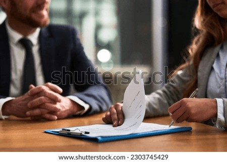 Documents, contract and business people writing signature for deal, partnership or legal paperwork in night office. Paper of lawyer woman, notary or partner hands for policy, compliance and agreement