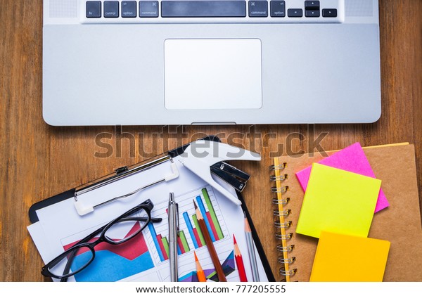 Documents Displaying Graphs On Desks Laptops Stock Photo Edit Now