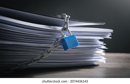 Documents locked with padlock and chains. - Shutterstock ID 2074436143