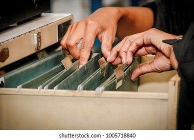 Documents In The Office : Find The File In The Drawer : Woman Working Hand Searching For File In Drawer, Filing Cabinet.


