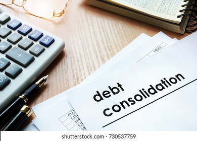 Documents with title debt consolidation on an office table. - Shutterstock ID 730537759