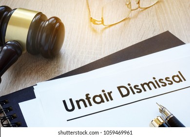 Documents Unfair Dismissal And Gavel In A Court.