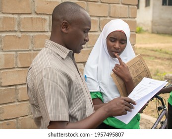 Dodoma, Tanzania. 08-18-2019. A Black Female Muslim Student Has A Private Meeting With Her Teacher At A Rural School In Tanzania.