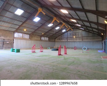 Dog Agility Jumps In An Indoor Barn