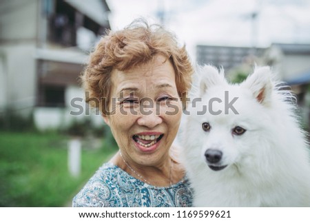 Dog and Asian elderly women
