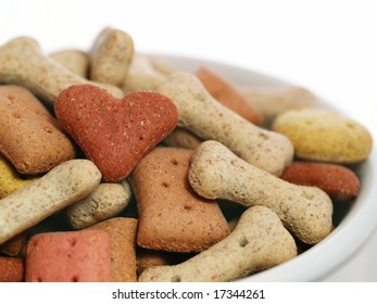 Dog biscuits in a china bowl. Pet lover concept.