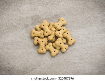 Dog Biscuits, Isolated On Granite Texture