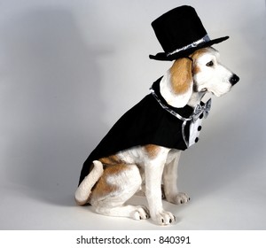 Dog in black tuxedo and top hat