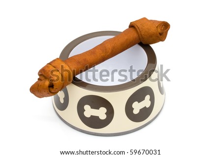A dog bone in a bowl isolated on a white background, treat your dog