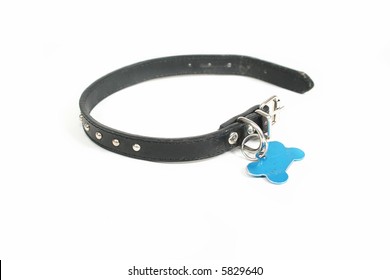 A Dog Collar With An Id Tag On It