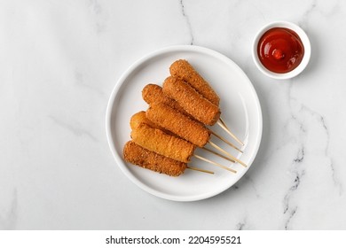 Сorn Dog, Corndog. Traditional American Street Food. Fried Sausage On A Stick. Homemade Corn Dogs On A White Plate. Top View, Copy Space.