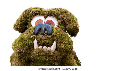 A Dog Figure Made With Artificial Turf Big Eyes And Big Fangs Over White Background. Animal Concept