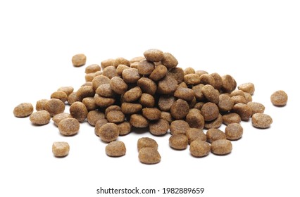 Dog food pile, dry granules for puppies and young dogs isolated on white background - Shutterstock ID 1982889659